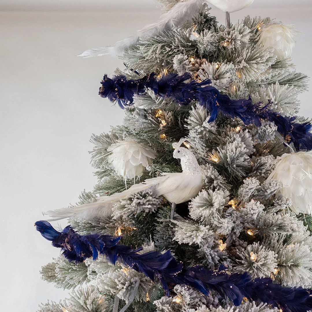 white christmas tree with blue decorations